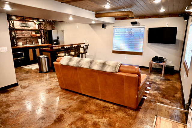 314 Brown Farm Lane Draper, UT 84020 - Photo 24 of 57 Open-concept entertainment space featuring unique multi-toned flooring, a wood-paneled ceiling, and recessed lighting
