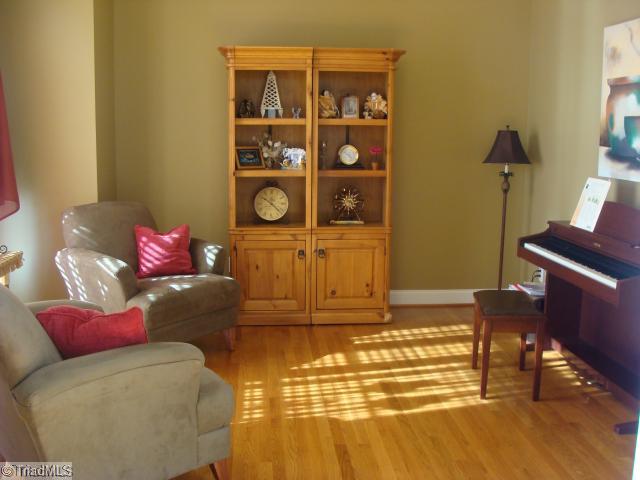 8502 Billet Place Oak Ridge, NC 27310 - Photo 5 of 11 Living Room. Formal Living Room with lots of light. Harwood Flooring and custom paint.