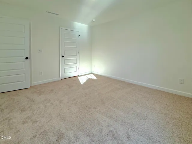 an empty room with a natural light