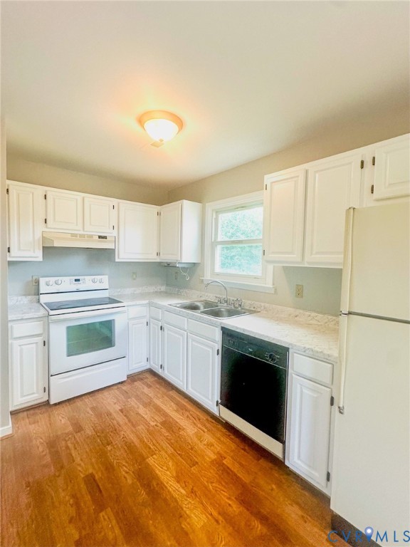 7530 South Genito Road Jetersville, VA 23083 - Photo 6 of 16 Kitchen featuring wood-finish flooring, white cabi