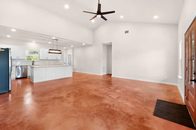 a view of a kitchen with a sink and a stove top oven