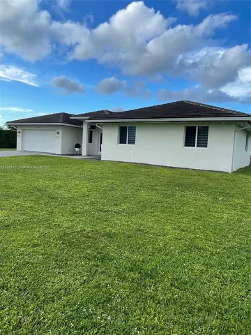 a kitchen with stainless steel appliances a stove a sink and a microwave