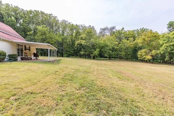 a backyard of a house with lots of green space