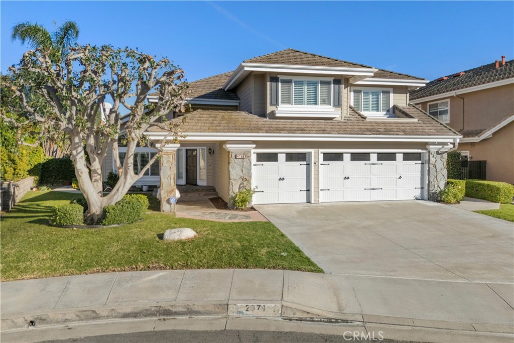 front view of a house with a yard