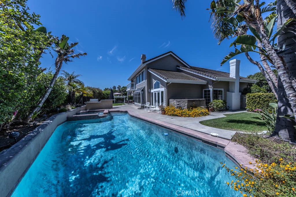 a view of a house with swimming pool yard porch and patio