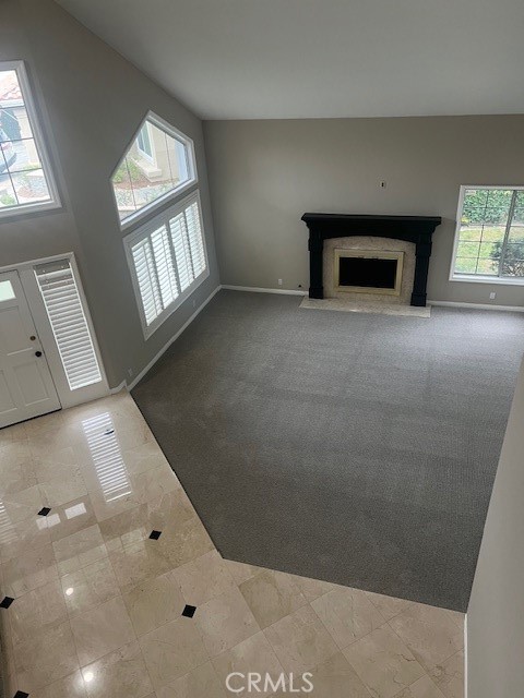 2871 North Roxbury Street Orange, CA 92867 - Photo 11 of 25 view of a livingroom with a fireplace and window