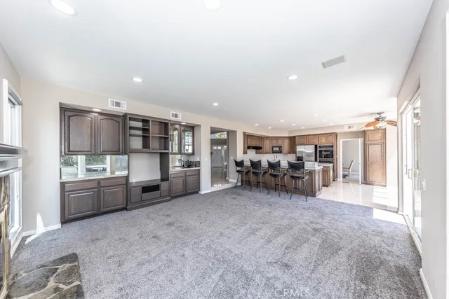 a view of a livingroom with furniture and white cabinets