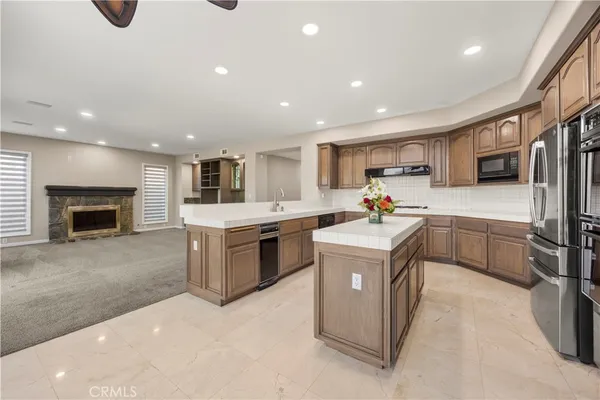 a kitchen with a stove sink and a refrigerator