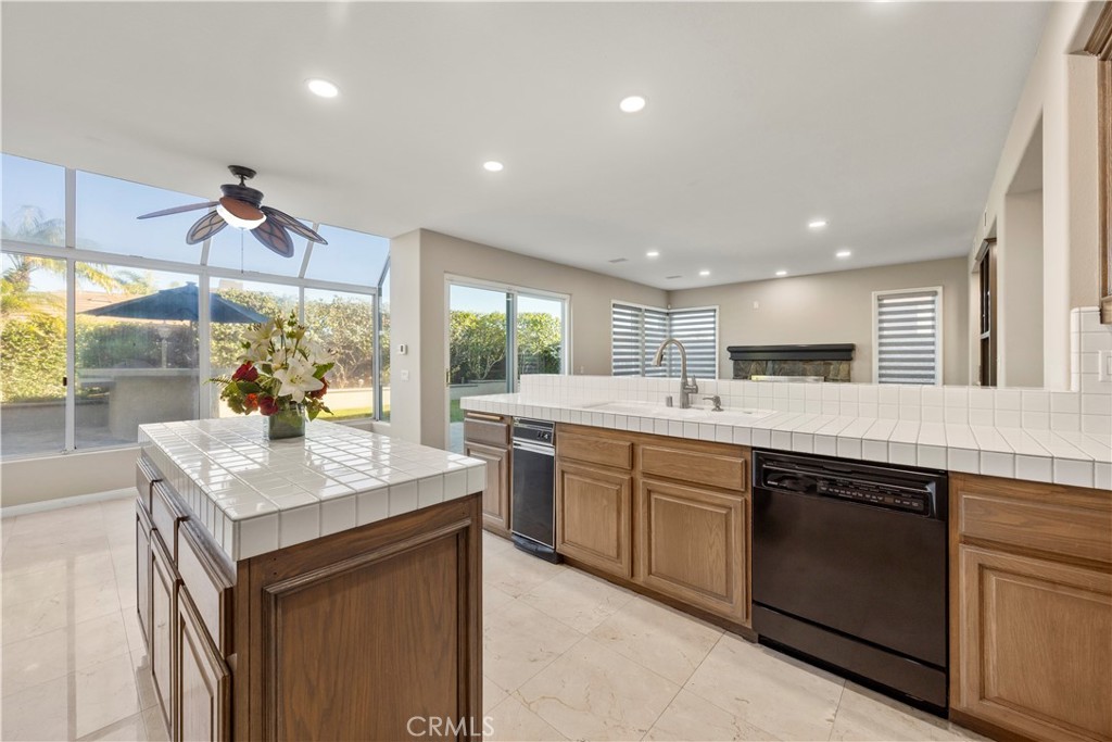 2871 North Roxbury Street Orange, CA 92867 - Photo 14 of 38 a kitchen with a sink stove and cabinets