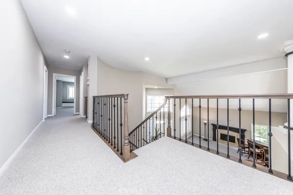 a view of staircase with white walls