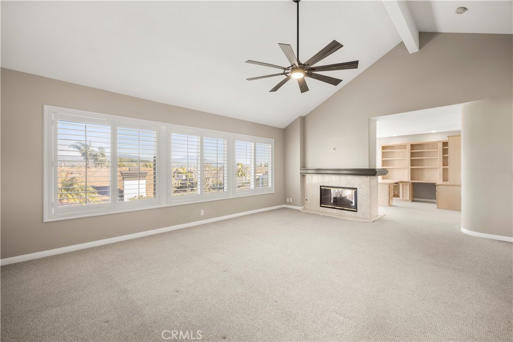 2871 North Roxbury Street Orange, CA 92867 - Photo 18 of 38 a view of an empty room with a window and a kitchen
