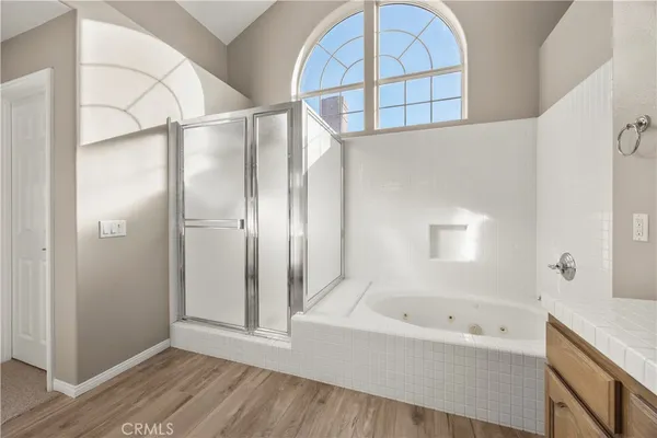a bathroom with a bathtub and a shower