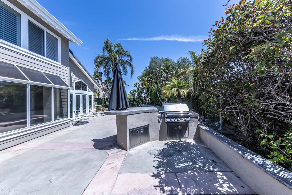 2871 North Roxbury Street Orange, CA 92867 - Photo 25 of 25 a view of a patio with couches table and chairs and potted plants