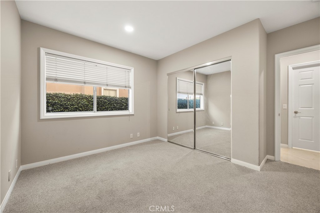 2871 North Roxbury Street Orange, CA 92867 - Photo 25 of 38 an empty room with windows and closet