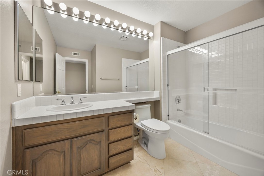 2871 North Roxbury Street Orange, CA 92867 - Photo 26 of 38 a bathroom with a sink toilet and shower