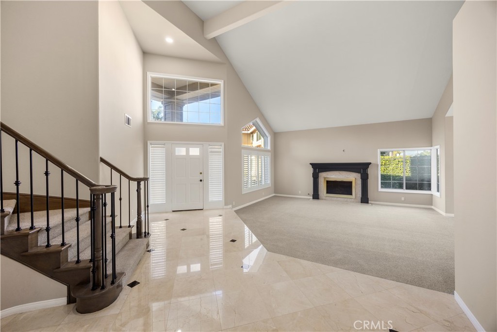 2871 North Roxbury Street Orange, CA 92867 - Photo 4 of 38 a view of an entryway with wooden floor and a fireplace