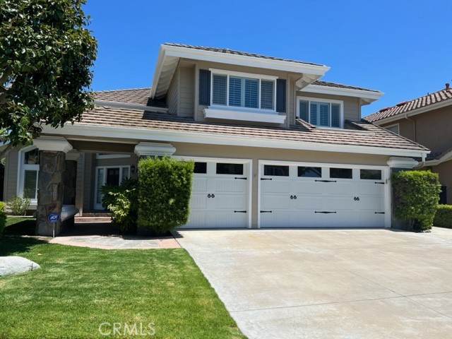 2871 North Roxbury Street Orange, CA 92867 - Photo 5 of 25 a front view of a house with a yard
