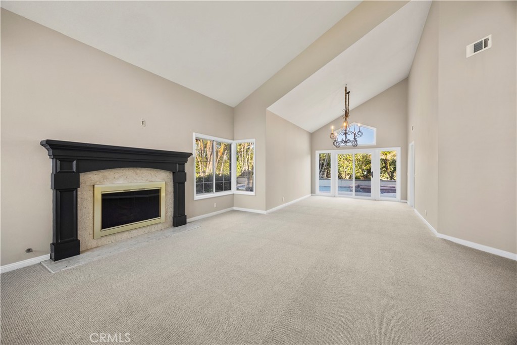 2871 North Roxbury Street Orange, CA 92867 - Photo 7 of 38 a view of a livingroom with an empty space and a fireplace