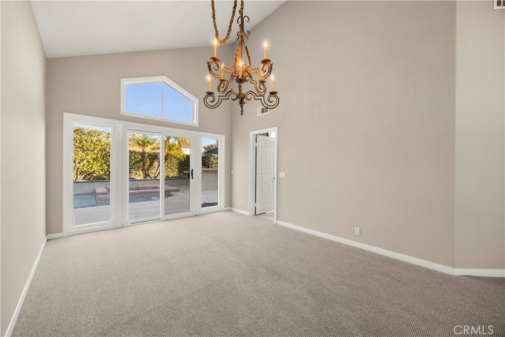 2871 North Roxbury Street Orange, CA 92867 - Photo 8 of 38 a view of a chandelier in big room with windows and chandelier