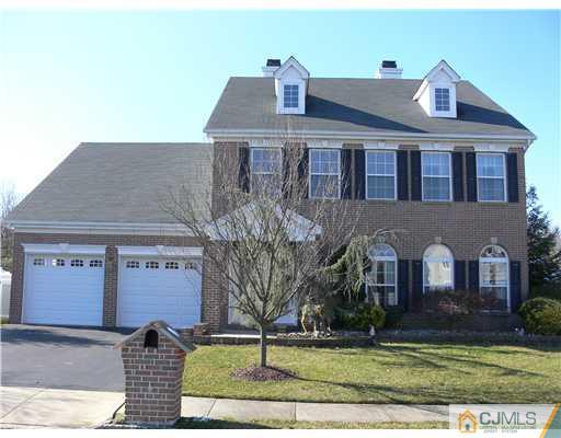 10 Bernadette Road Morganville, NJ 07751 - Photo 1 of 24 a front view of a house with garden