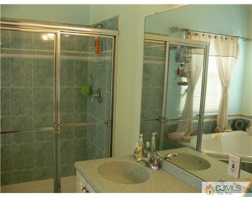 10 Bernadette Road Morganville, NJ 07751 - Photo 13 of 24 a bathroom with a shower and a sink