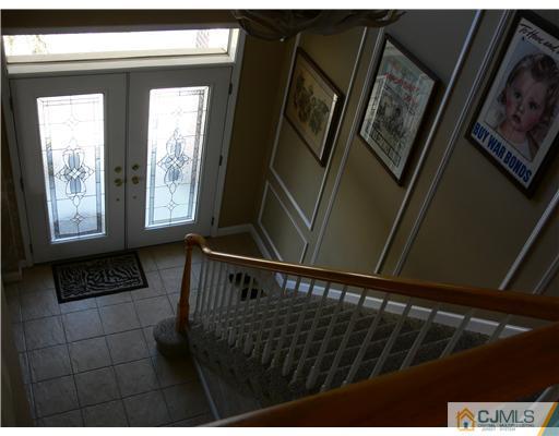 10 Bernadette Road Morganville, NJ 07751 - Photo 18 of 24 a view of stairs and with wooden floor