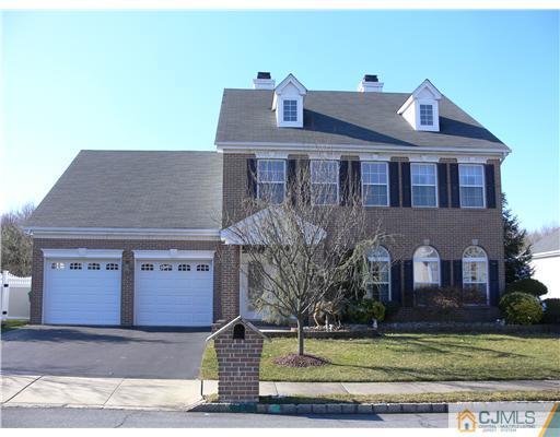 10 Bernadette Road Morganville, NJ 07751 - Photo 23 of 24 a front view of a house with a yard