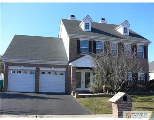 10 Bernadette Road Morganville, NJ 07751 - Photo 24 of 24 a front view of a house with garden