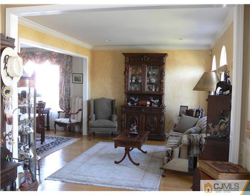 10 Bernadette Road Morganville, NJ 07751 - Photo 4 of 24 a living room with furniture windows and a table