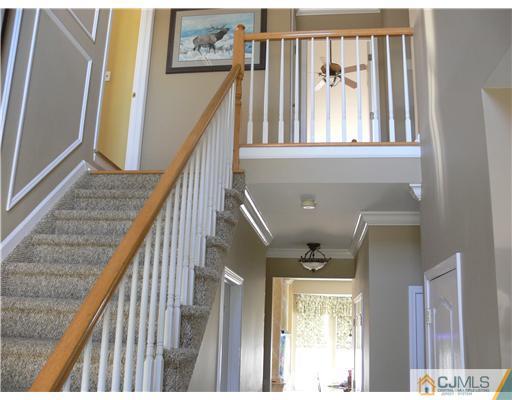 10 Bernadette Road Morganville, NJ 07751 - Photo 9 of 24 a view of entryway and hall with wooden floor