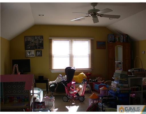 10 Bernadette Road Morganville, NJ 07751 - Photo 10 of 24 a living room with furniture and a window