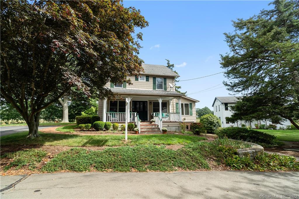 46 South Cove Road Old Saybrook, CT 06475 - Photo 1 of 1 a front view of a house with a yard