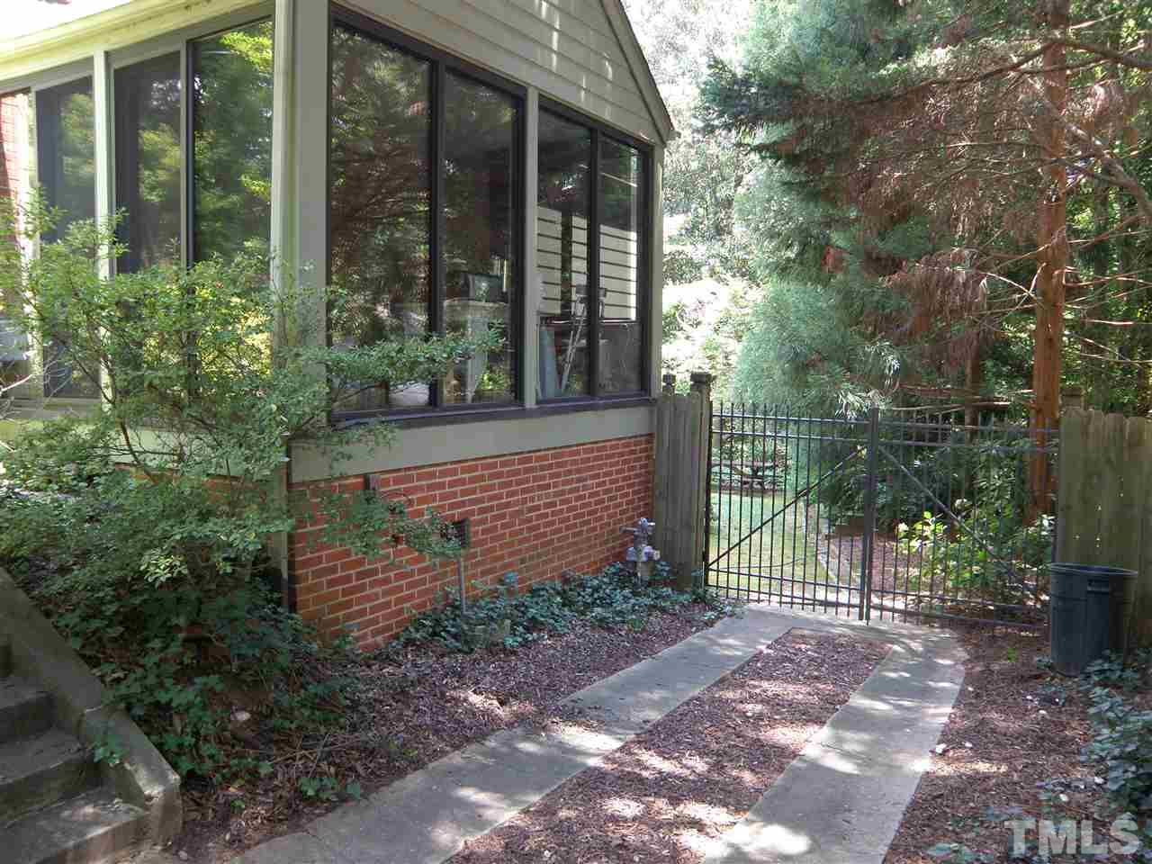 204 Furches Street Raleigh, NC 27607 - Photo 3 of 5 a view of a house with backyard and garden