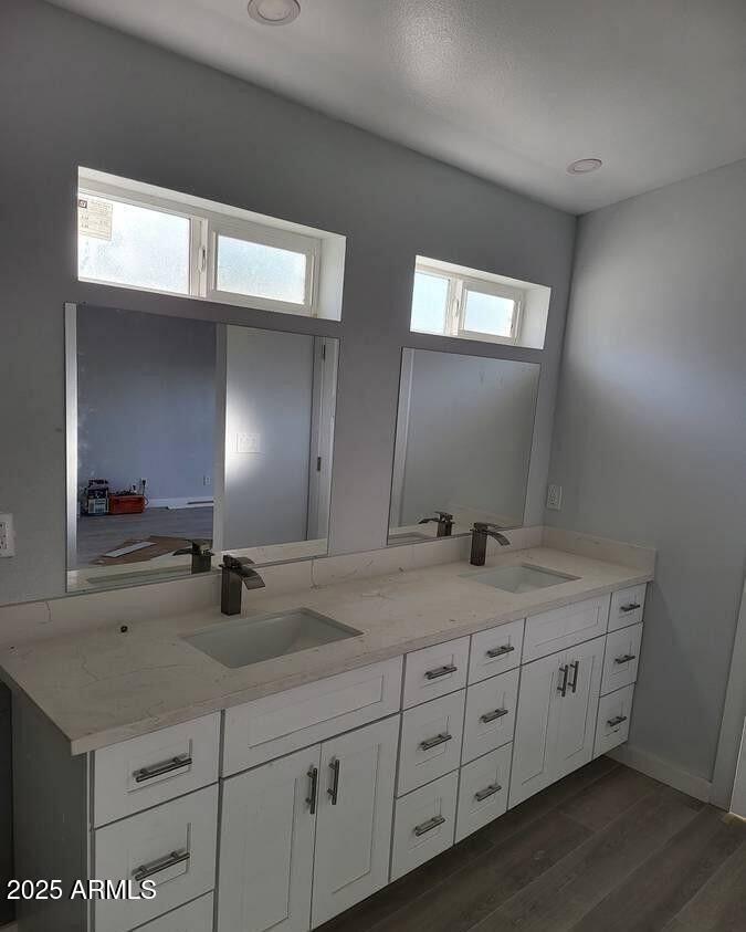 2511 East Broadway Road Phoenix, AZ 85040 - Photo 11 of 17 a bathroom with double sink and a mirror