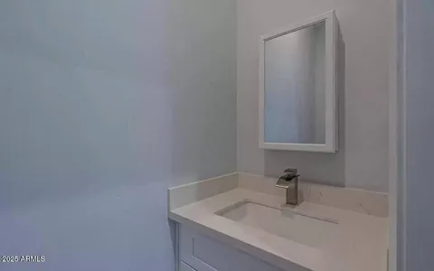 a bathroom with a sink and vanity
