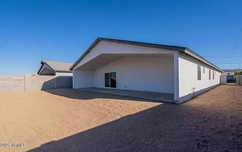 a backyard of a house with garage