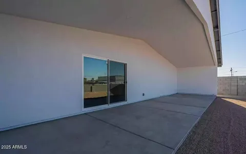 a view of an empty room with a bathroom