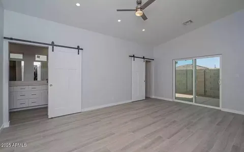 wooden floor in an empty room with a mirror