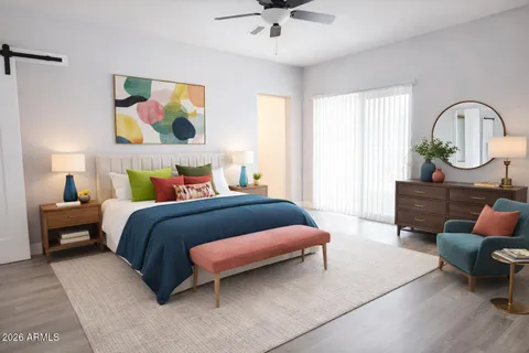 a bedroom with a bed and a couch