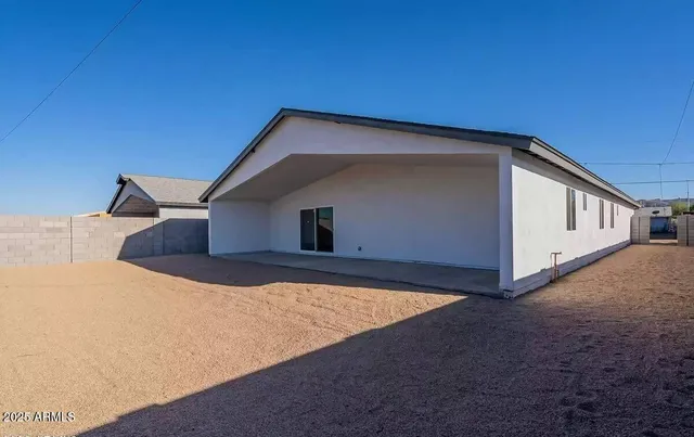 a backyard of a house with garage