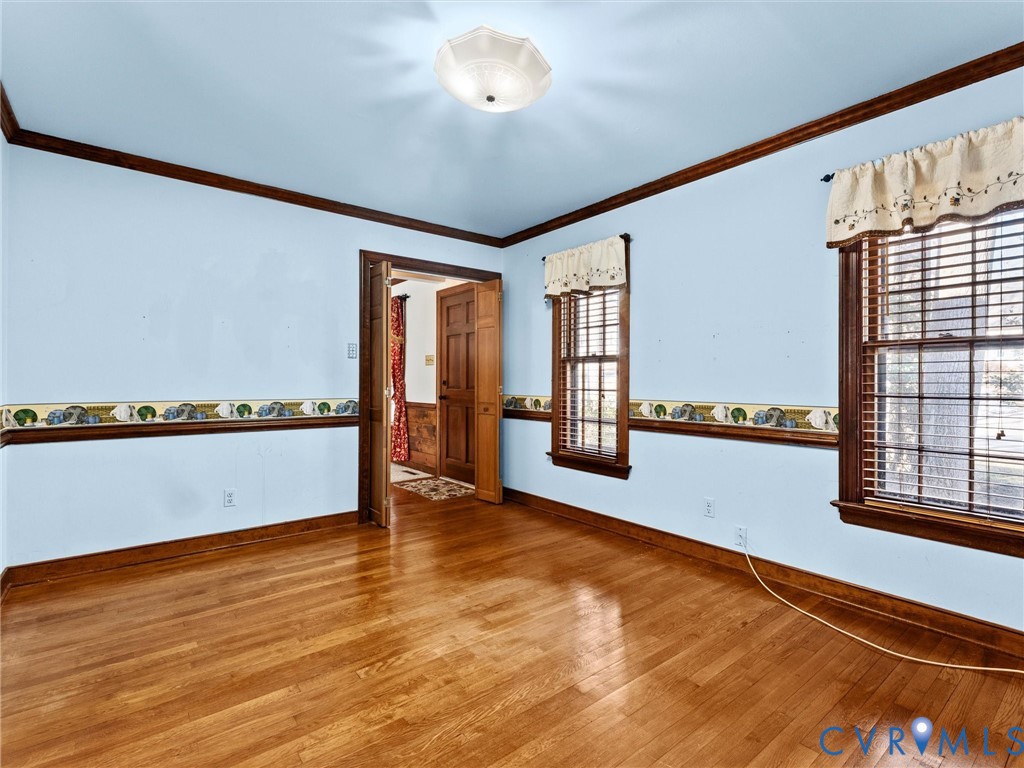 4701 Black Oak Road North Chesterfield, VA 23237 - Photo 11 of 47 a view of an empty room with a window and wooden floor