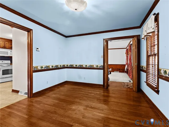 a bathroom with a toilet a sink and a mirror