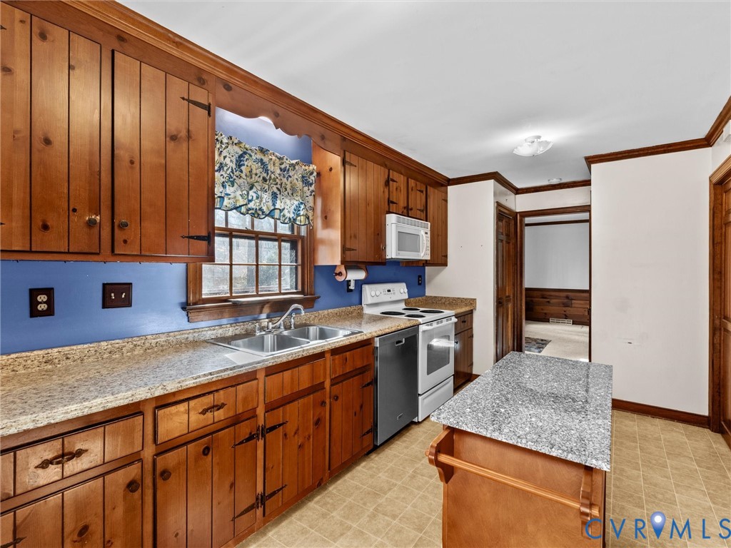 4701 Black Oak Road North Chesterfield, VA 23237 - Photo 17 of 47 a kitchen with stainless steel appliances granite countertop wooden cabinets a sink and dishwasher