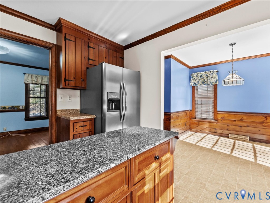 4701 Black Oak Road North Chesterfield, VA 23237 - Photo 19 of 47 a kitchen with stainless steel appliances granite countertop a refrigerator and a stove