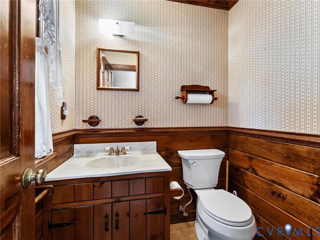 4701 Black Oak Road North Chesterfield, VA 23237 - Photo 25 of 47 a bathroom with a toilet a sink and a mirror
