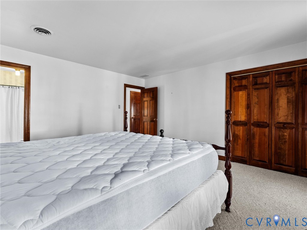 4701 Black Oak Road North Chesterfield, VA 23237 - Photo 30 of 47 a bedroom with a bed and a cabinet
