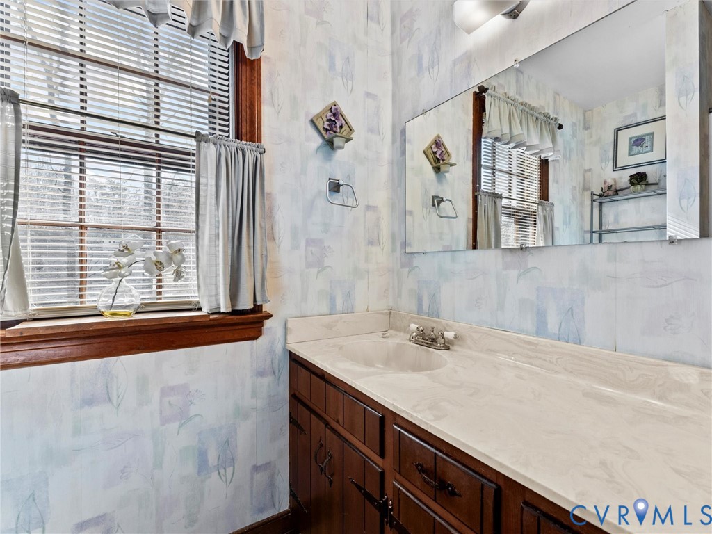 4701 Black Oak Road North Chesterfield, VA 23237 - Photo 37 of 47 a bathroom with a sink and a mirror