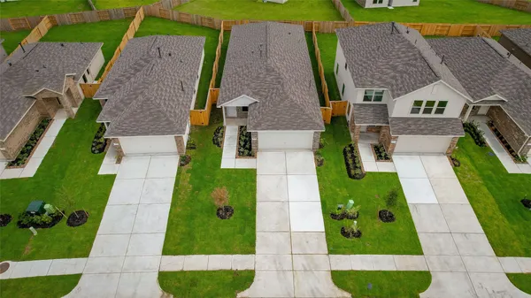 aerial view of a house with a backyard space