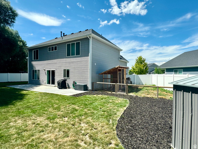 1148 290 South Logan, UT 84321 - Photo 33 of 34 Two-story exterior with light gray siding, dark gray siding, and a dark shingle roof
