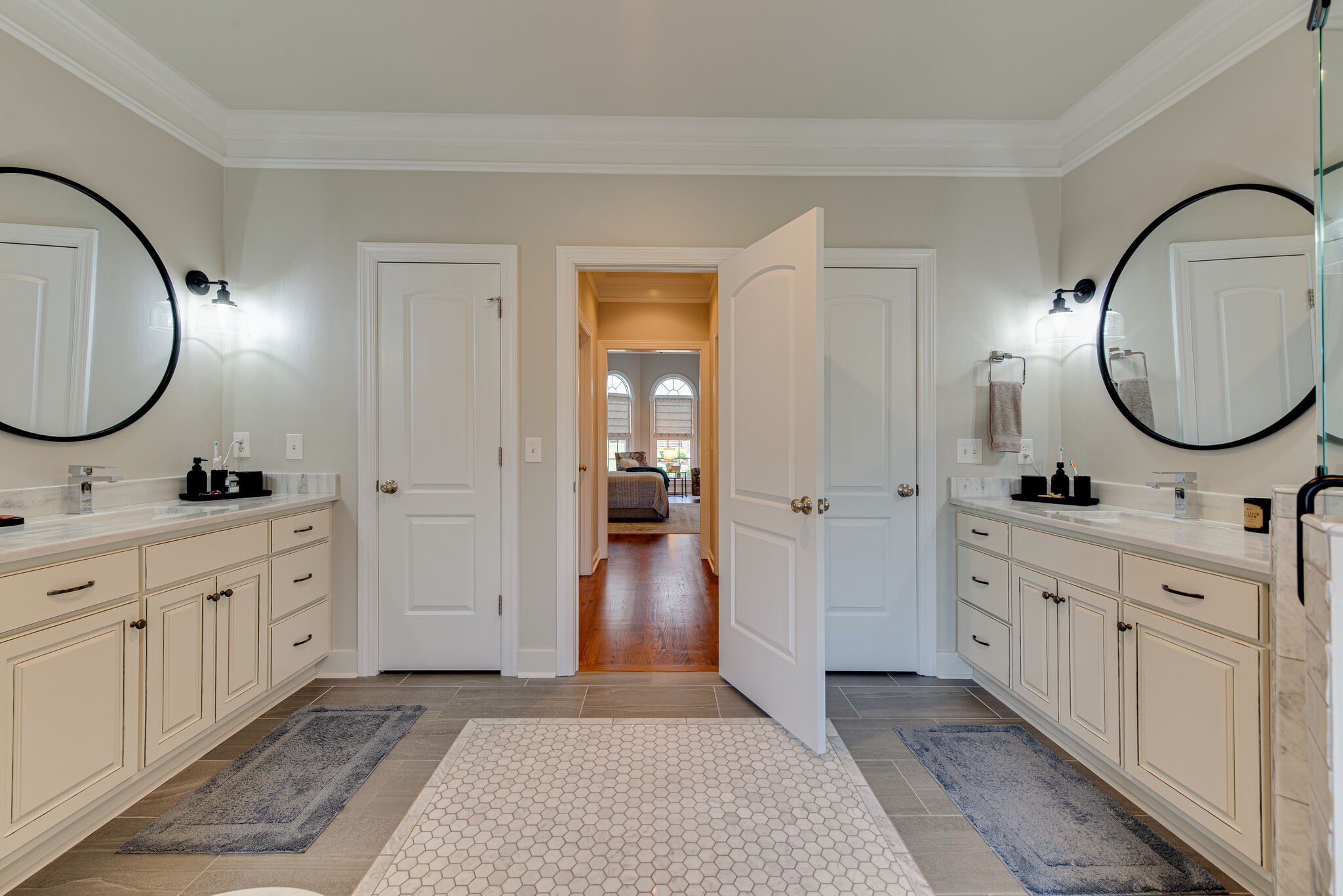 1027 Red Pepper Ridge Spring Hill, TN 37174 - Photo 19 of 38 a spacious bathroom with a double vanity sink and a mirror